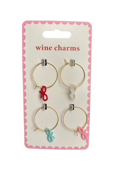 Picture of 4 x pretty bows wine glass charms gold in colour with assorted colour bows