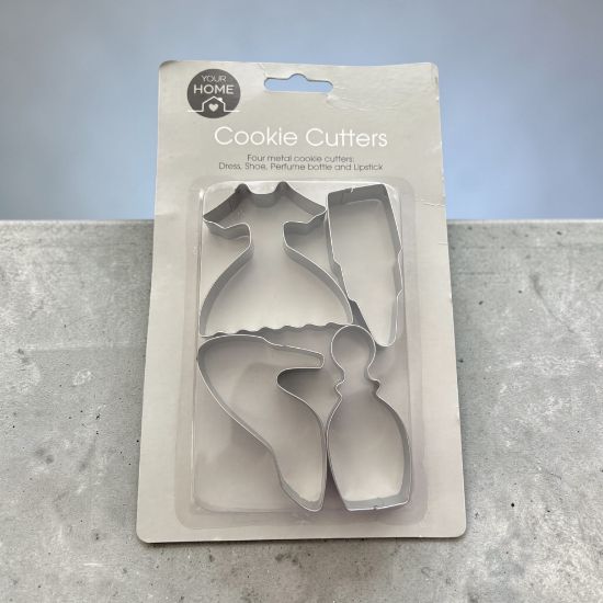 Picture of 4 x metal cookie cutters - shoe, dress perfume bottle lipstick shapes New