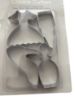 Picture of 4 x metal cookie cutters - shoe, dress perfume bottle lipstick shapes New