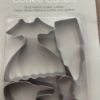 Picture of 4 x metal cookie cutters - shoe, dress perfume bottle lipstick shapes New