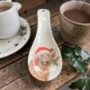 Picture of Christmas HIghland cow design Spoon Rest kitchen utensil Christmas Higland Cow in santa hat